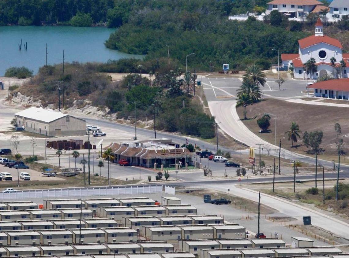 A red truck is parked at the McDonald’s drive-thru on Sherman Avenue March 30, 2009 opposite a trailer park for U.S. soldiers and sailors on temporary assignment on the base, who work for the detention center. At the top right is the base chapel complex, which has both a mosque for Muslims and a shrine to the Virgin of Our Lady of Charity.