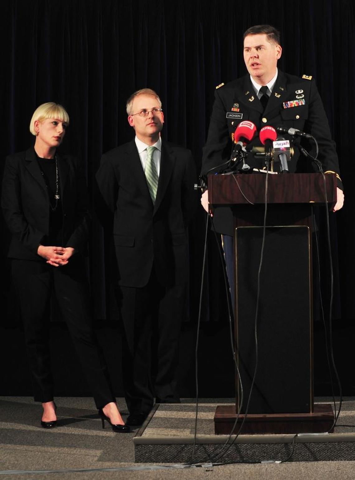 Army Lt. Col. Jon Jackson, military lawyer for Majid Khan, talks to reporters on Feb. 29, 2012. From left, Katya Jestin and Wells Dixon, two other lawyers on Khan’s team. Jackson has since retired from the military and Khan wants him brought back on the case as a civilian, Pentagon paid attorney.