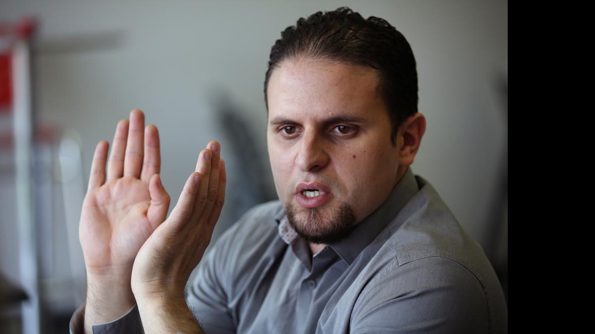 
In this May 13, 2015 photo, former Guantánamo detainee and al-Qaida trainee Mourad Benchellali talks during an interview with the Associated Press in Gennevilliers, suburban Paris, France. 
