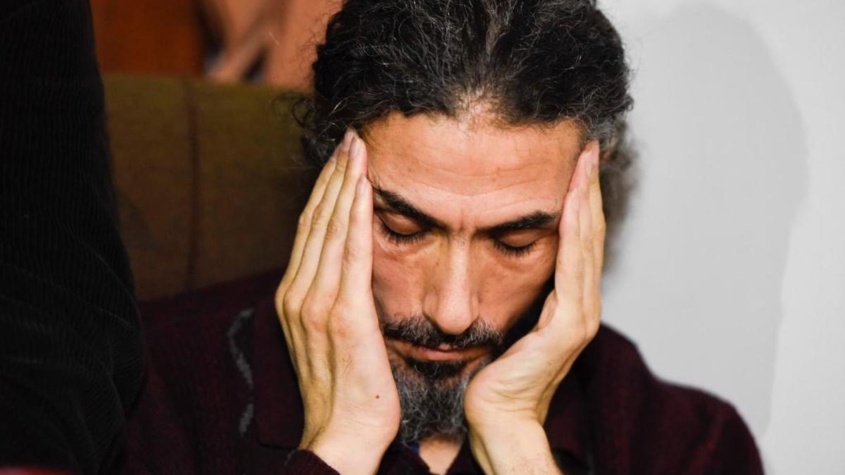Former Guantanamo detainee, Syrian Abu Wa'el Dhiab listens to a question during a press conference in his apartment in Montevideo, Uruguay, Friday, Sept. 30, 2016.