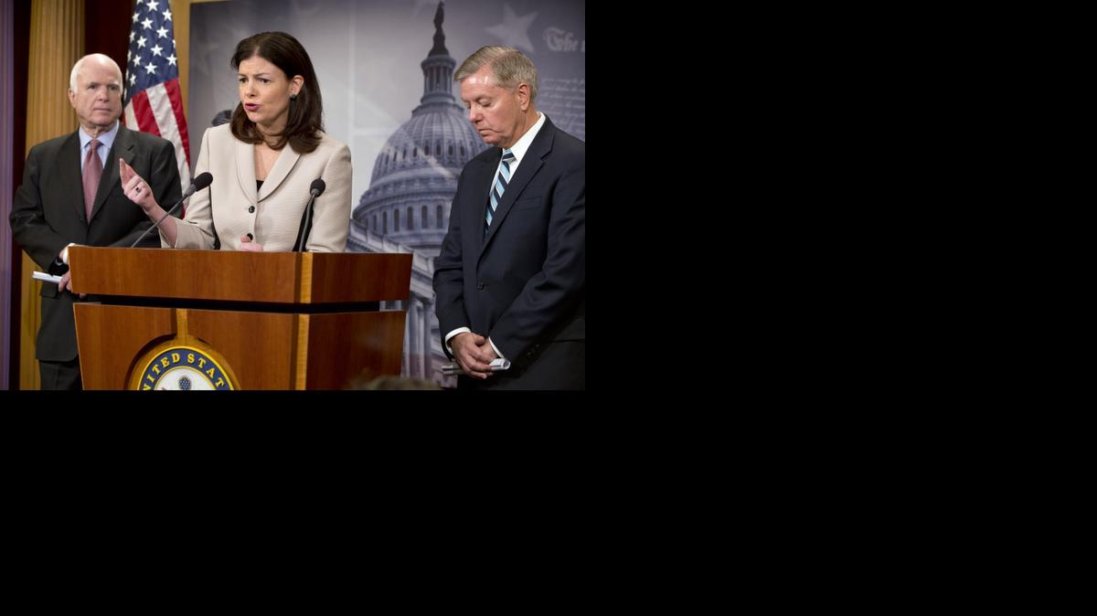 
Sen. Kelly Ayotte, R-N.H., center, flanked by Senate Armed Services Committee Chairman Sen. John McCain, R-Ariz., left, and and Sen. Lindsey Graham, R-S.C., speaks during a news conference on Capitol Hill in Washington, Tuesday, Jan. 13, 2015, to discuss the military prison at Guantánamo Bay, Cuba. 
