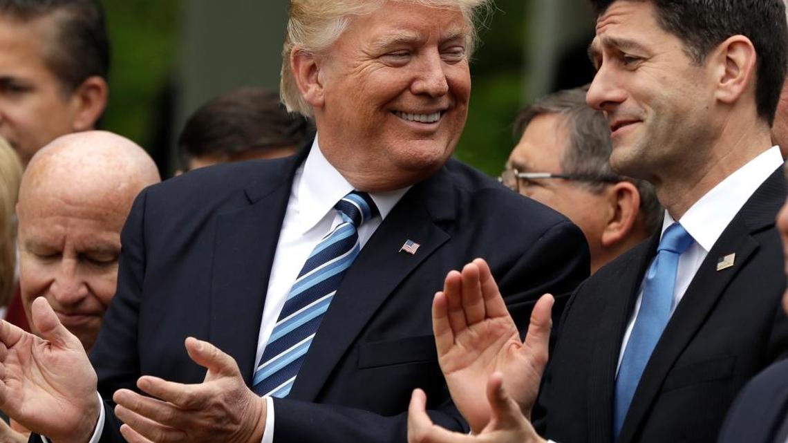 In this May 4, 2017, photo, President Donald Trump talks to House Speaker Paul Ryan of Wis. in the Rose Garden of the White House in Washington, after the House pushed through a health care bill.
