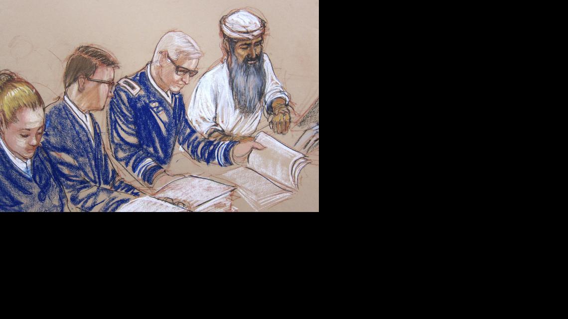 
In this Pentagon-approved sketch by court artist Janet Hamlin, Abdul al Hadi al Iraqi is arraigned on war crimes charges at the U.S. Navy Base at Guantanamo Bay, Cuba, Wednesday, June 18, 2014. Hadi, who had a long grey beard and wore a white tunic and headdress, listened calmly as the charges were listed. He did not enter a plea during the half-hour session. His defense shown from left to right, Navy Chief Jennifer Bailey, paralegal, Air Force Major Ben Stirk, and Army Lt. Col. Christopher Callen. 
