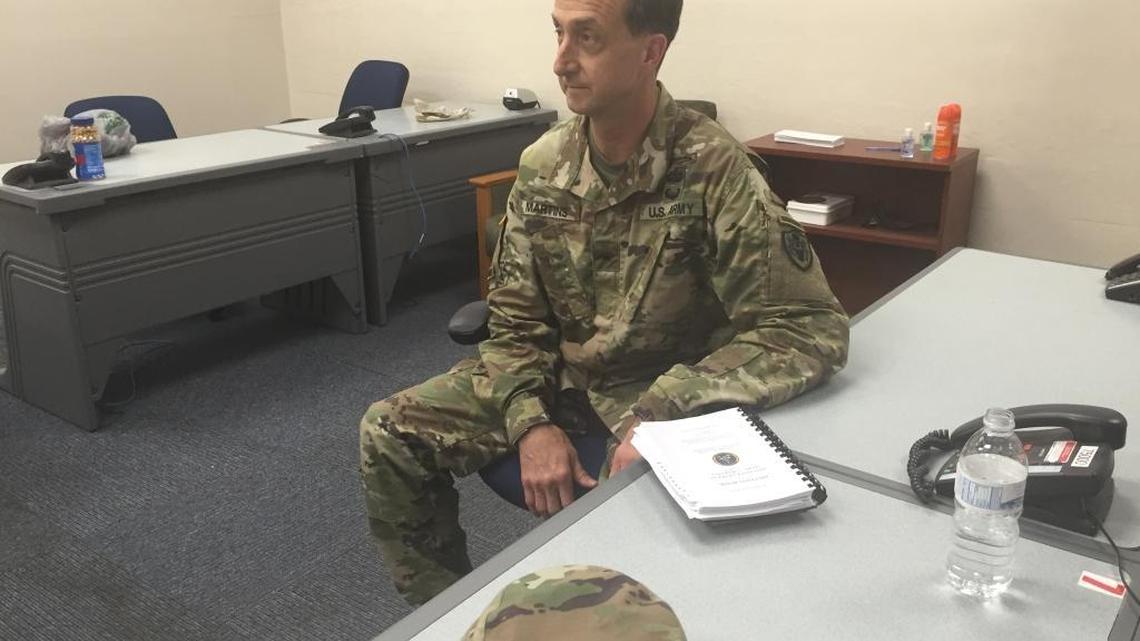 Army Brig. Gen. Mark Martins, chief war crimes prosecutor, briefs reporters Sunday, July 17, 2106.