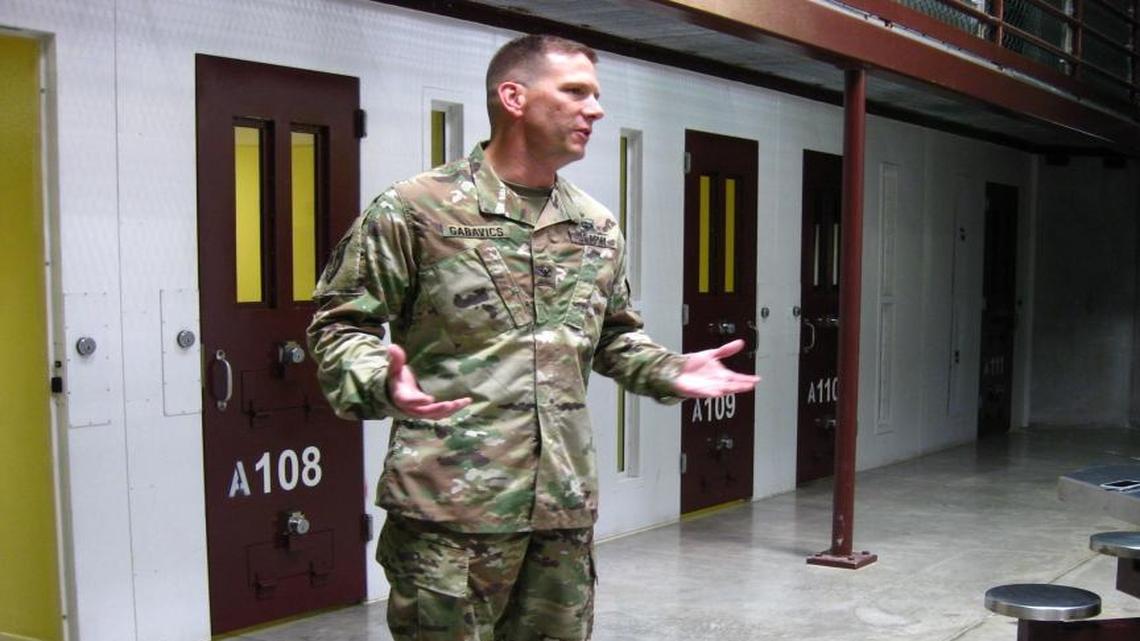 Army Col. Steve Gabavics, the new guard force commander, functionally the warden of detention operations at Guantánamo, briefing reporters in an empty cellblock at the communal Camp 6 prison building on Saturday, July 9, 2016. This photo was reviewed and approved for release by a member of the U.S. military, a condition of media access to the Detention Center Zone.