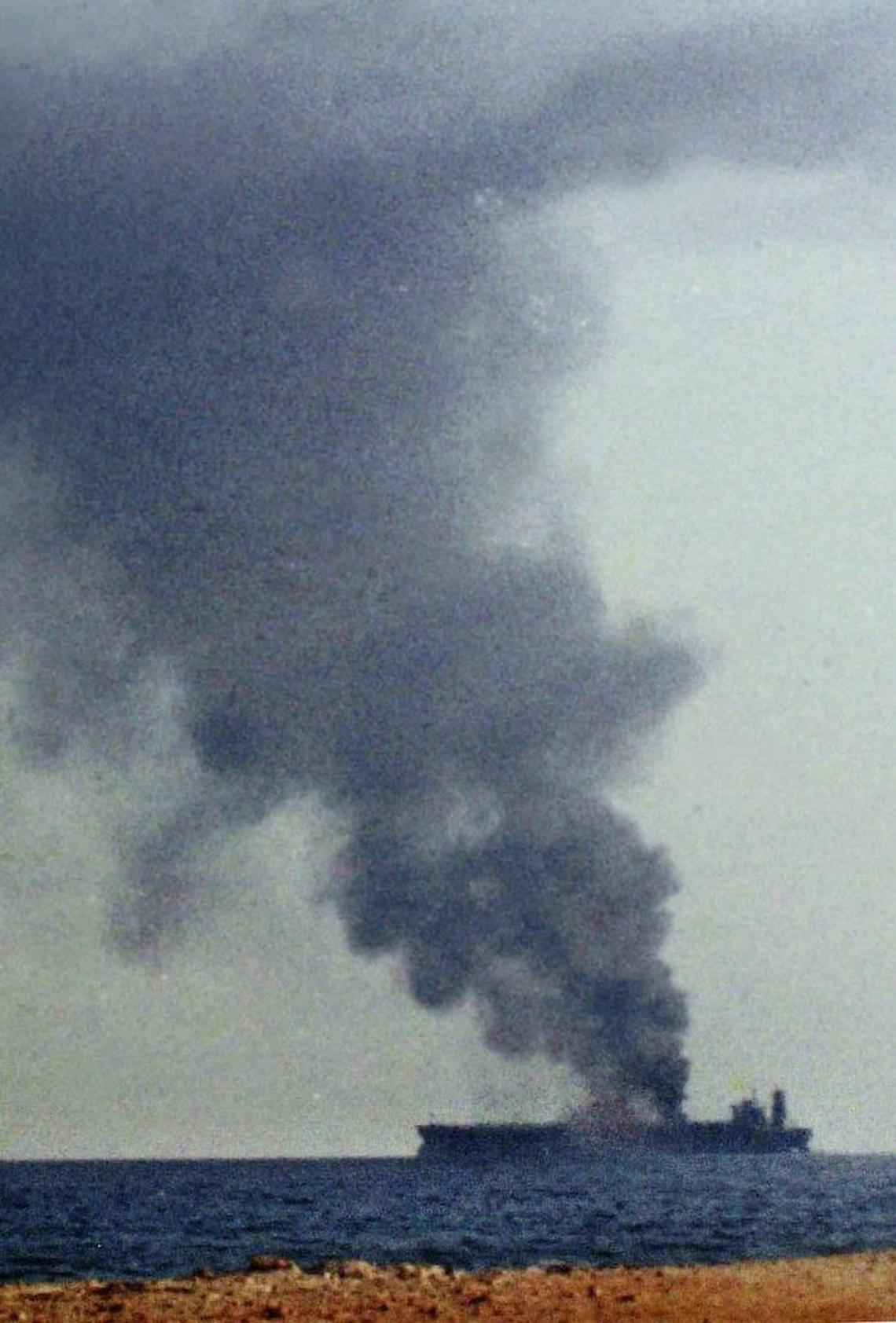 Smokes rises from the French oil tanker Limburg as it blazes off the Yemeni coastal town of al-Mukalla on Oct. 6, 2002.