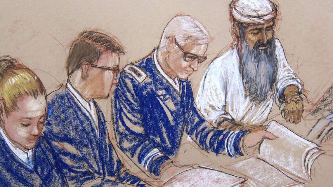 
In this Pentagon-approved sketch by court artist Janet Hamlin, Abd al Hadi al Iraqi is arraigned June 18, 2014 at the U.S. Navy base at Guantánamo Bay, Cuba. Hadi, at far right, sat with his second of so far three legal defense teams, from left: Navy Chief Jennifer Bailey, a paralegal; Air Force Major Ben Stirk, and Army Lt. Col. Chris Callen.
