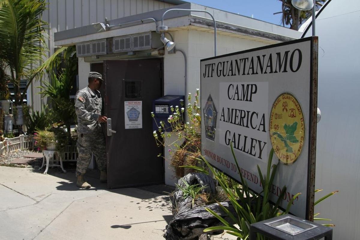 At lunchtime, a soldier walks into the Camp America Galley — known to troops as Seaside Galley for its waterfront views — in this U.S. military photo published in the April 17, 2015 edition of the now-defunct Detention Center staff newsletter, The Wire.