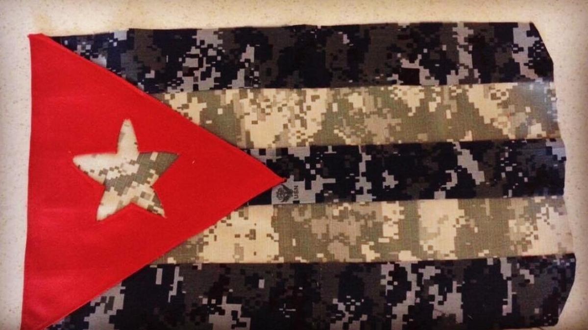A work-in-progress version of a flag crafted from discarded uniforms by Maria Conrad, the wife of a contractor at Guantánamo Bay, Cuba, that was seized by base police on Friday, Nov. 3, 2017. The blue fabric comes from a Navy Working Uniform due to become obsolete in October 2019 while the other stripes come from an Army Combat Uniform due to become obsolete in September 2019.