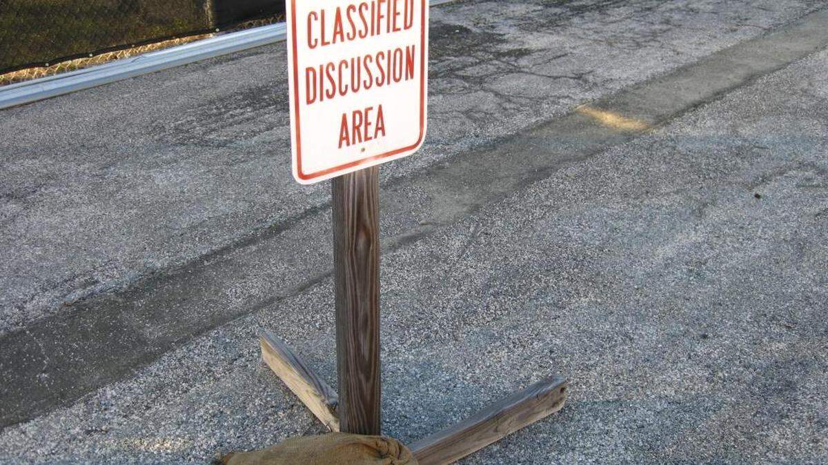 A military approved photo of a sign in the spectators’ waiting area outside the top secret courtroom at Camp Justice, U.S. Navy base, Guantánamo Bay, Cuba on Dec. 3, 2016