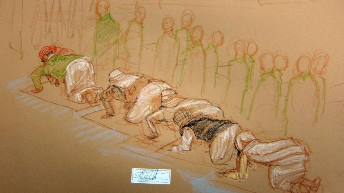 The five accused Sept. 11 conspirators at prayer during a break in a hearing inside the war court on Dec. 5, 2016 at 9/11 pretrial hearings at the U.S. Navy base at Guantánamo Bay, Cuba, in a sketch approved by the Pentagon. From left, mastermind Khalid Sheik Mohammad, Walid bin Attash, Ramzi Bin al Shibh, Ammar al Baluchi and Mustafa al Hawsawi.