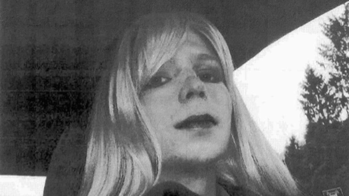 In this undated file photo provided by the U.S. Army, Pfc. Chelsea Manning poses for a photo wearing a wig and lipstick. Manning, a transgender soldier now serving 35 years at the Fort Leavenworth, Kansas military prison for leaking classified information to WikiLeaks, is asking President Barack Obama to commute her sentence to the 6 1/2 years she has already served.
