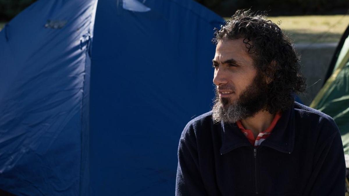 Abu Wa’el Dhiab, from Syria, sits in front of the U.S. embassy on May 5, 2015 in Montevideo, Uruguay. Authorities reported on Monday, July 24, 2017, that Dhiab has returned to Uruguay after being deported from Morocco.