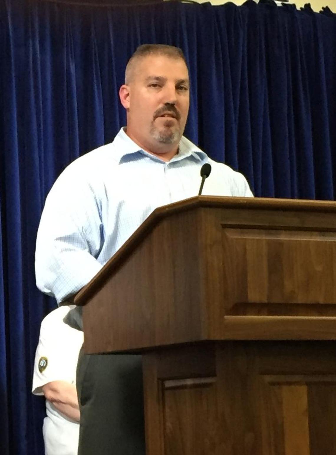 Joe Pelly, a USS Cole bombing survivor and a retired senior chief petty officer, speaks to reporters at the U.S. Navy base at Guantánamo on Sept. 9, 2016.