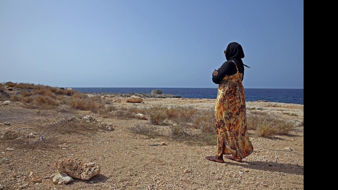 
Sgt. 1st Class A posed for the Miami Herald on Thursday, July 9, 2015 at the U.S. Navy base at Guantánamo Bay, Cuba, in her civilian, prayer garb not far from the dining room for prison guards and other staff, in a photo framed under U.S. military rules of access to keep her identity anonymous. A platoon sergeant by day, she dresses like any other U.S. soldier, in battle dress, with no traditional Muslim head cover, but says in civilian life she covers her hair in keeping with her practice of Islam. U.S. Army soldiers reviewed this photo invoking Pentagon security restrictions and cleared it for release.
