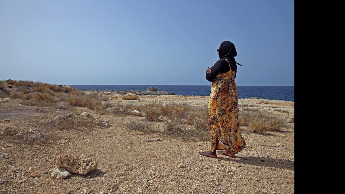 
Sgt. 1st Class A posed for the Miami Herald on Thursday, July 9, 2015 at the U.S. Navy base at Guantánamo Bay, Cuba, in her civilian, prayer garb not far from the dining room for prison guards and other staff, in a photo framed under U.S. military rules of access to keep her identity anonymous. A platoon sergeant by day, she dresses like any other U.S. soldier, in battle dress, with no traditional Muslim head cover, but says in civilian life she covers her hair in keeping with her practice of Islam. U.S. Army soldiers reviewed this photo invoking Pentagon security restrictions and cleared it for release.

