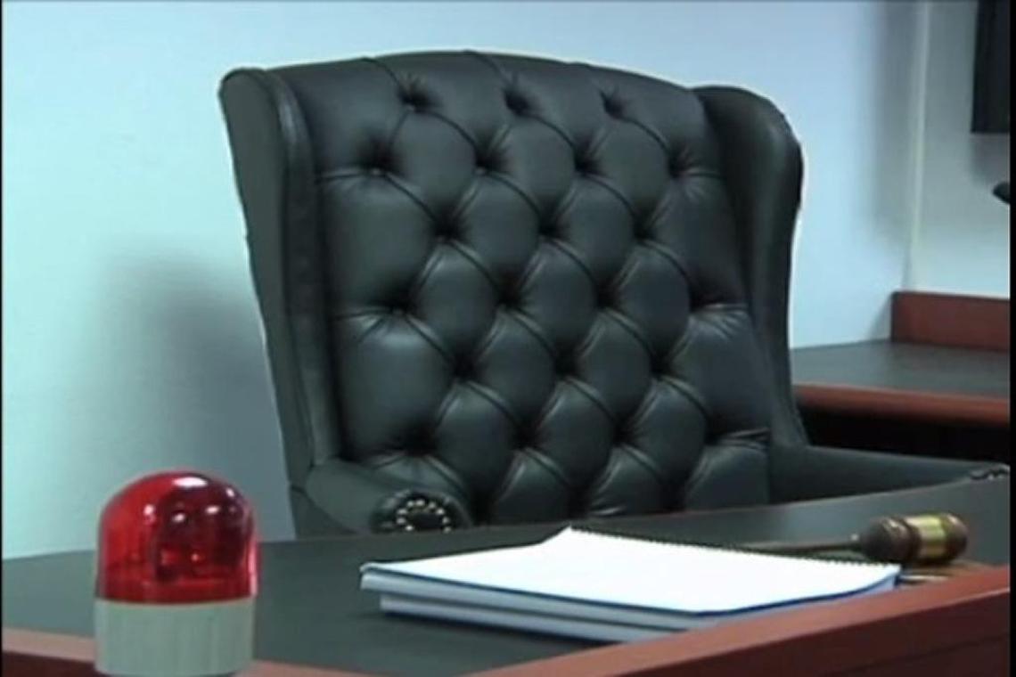 The judge’s bench seat in the courtroom at Guantánamo’s Camp Justice in a screen-grab from a 2013 Pentagon handout video. At left is a red light that goes off when a court security officer, or the judge, pushes a kill switch on audio feeds from the court. Independent news photography is generally forbidden inside the court.