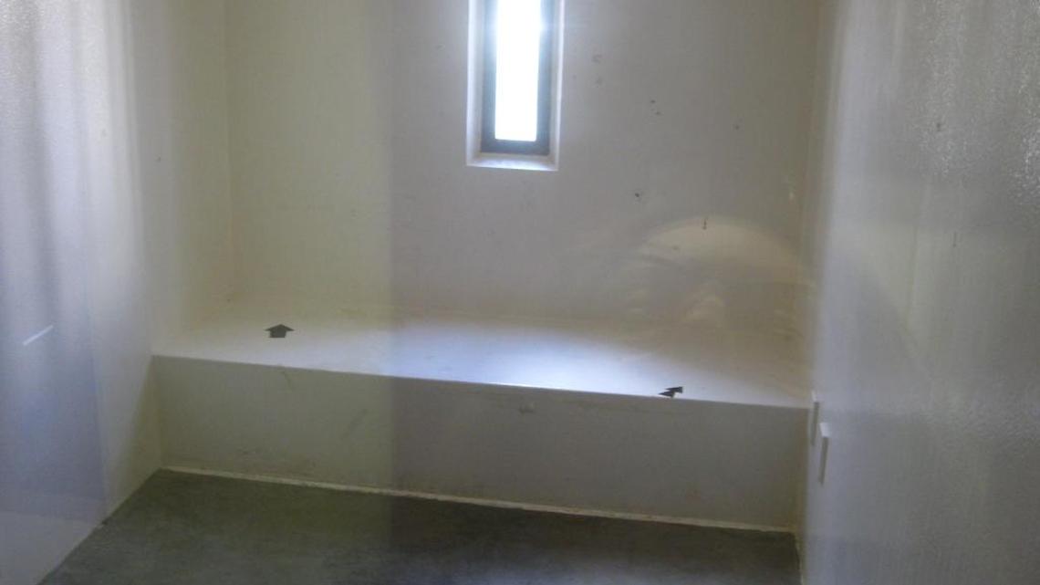An empty cell on Saturday, July 9, 2016 at the Camp 5 maximum-security prison, where military leaders reported all of Guantánamo’s remaining captives were in “highly complaint status,” meaning they were following the rules and that none were wearing the orange jumpsuit of the disobedient.