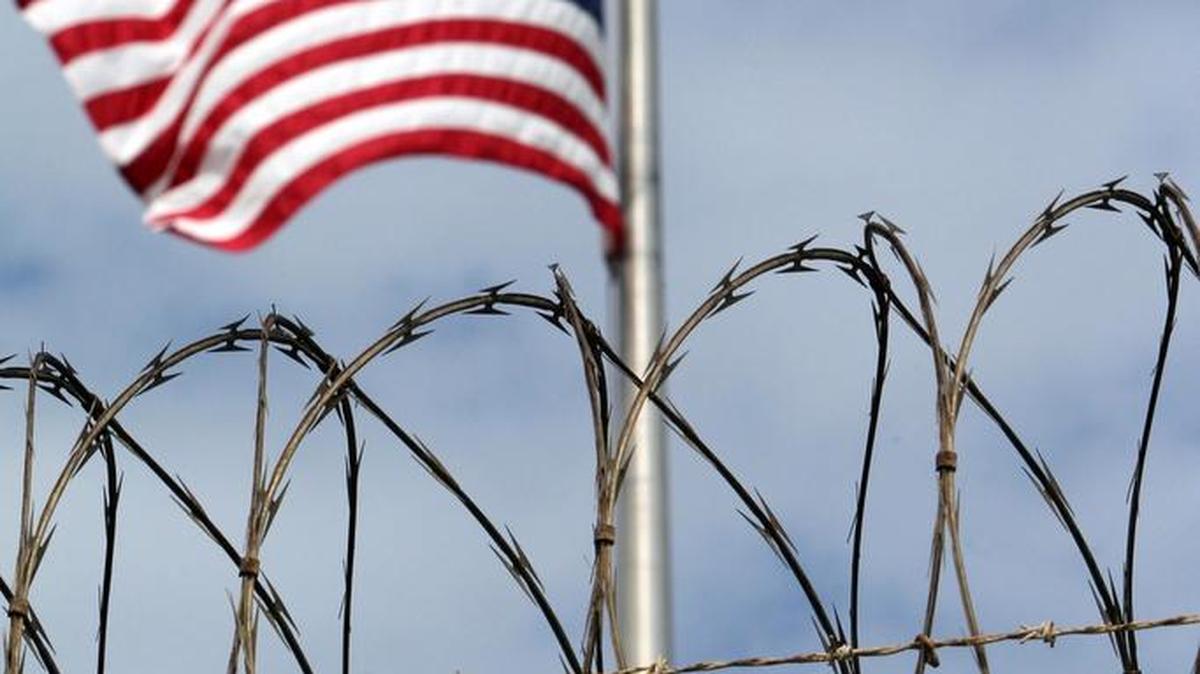 The American flag flies over Camp 6, at the U.S. Navy base at Guantánamo Bay, Cuba, on Feb. 9, 2016, in this photo approved for release by the U.S. military.
