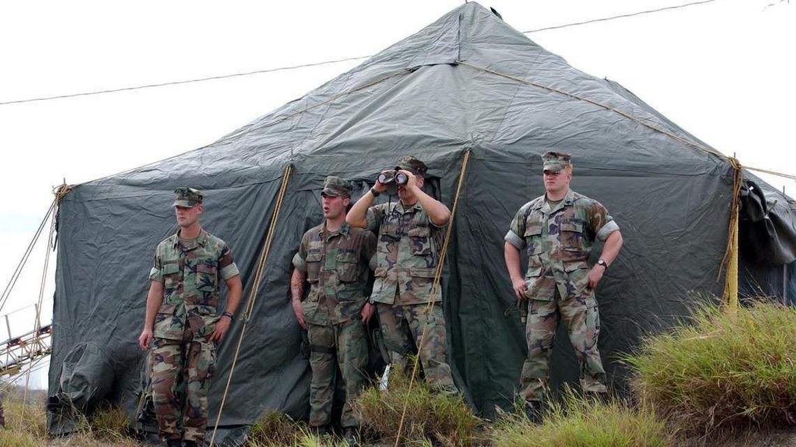 U.S. Marines watch over Camp X-Ray on Jan. 9, 2002 at the U.S. Navy base at Guantánamo Bay two days before the facility opened with the arrival of the first 20 captives from Afghanistan.
