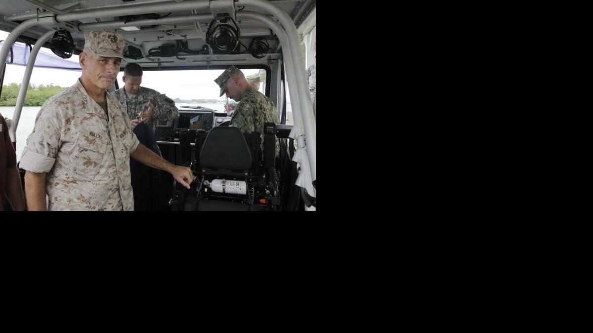 
Marine Gen. John F. Kelly, the commander of U.S. Southern Command, arrives at the U.S. Navy base in Guantánamo Bay, Cuba, to visit with troops and meet with officials on Saturday, June 7, 2014. 
