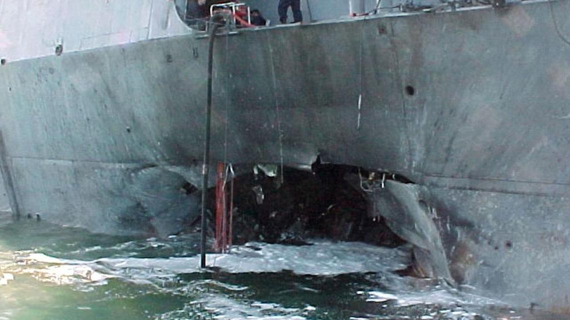 The U.S. Navy released this view of damage sustained on the port side of the Arleigh Burke class guided missile destroyer USS Cole after a suspected terrorist bomb exploded during a refueling operation in the port of Aden, Yemen, on Oct. 12, 2000.