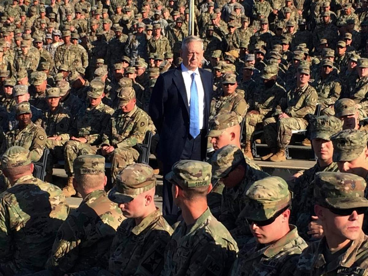 Defense Secretary Jim Mattis talks to troops at an outdoor movie theater at the U.S. Navy base at Guantánamo Bay, Cuba, on Thursday, Dec. 21. 2017.