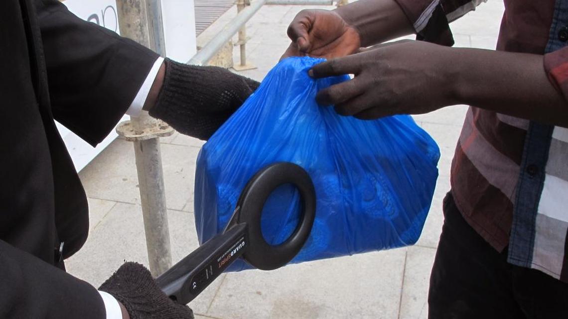 Security personnel check a persons bag while scanning it before he is allowed to enter the Sea Plaza Mall complex, that is beside the city’s Radisson Blu Hotel in Dakar, Senegal, Tuesday, March 22, 2016. Armed police now patrol the Ivory Coast beach where Islamic extremists killed at least 19 people earlier this month. And in Senegal’s capital, Dakar, cars are pulled over for security checks of trunks, back seats and bags.