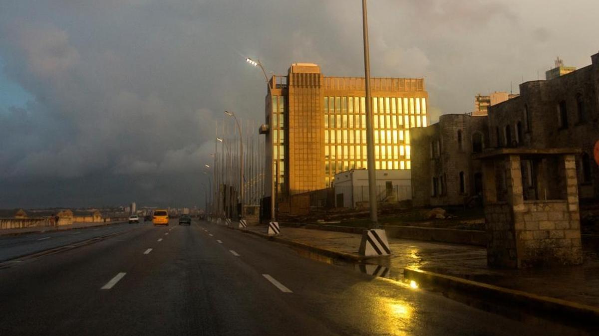 In this Oct. 14, 2017 photo, rays from the setting sun shine on the facade of the United States Embassy, in Havana, Cuba. (AP Photo/Desmond Boylan)