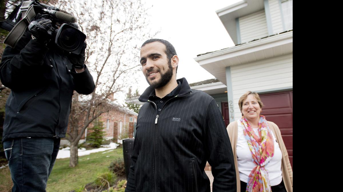 
Omar Khadr walks out of his lawyer Dennis Edney's home to speak the media in Edmonton, Alberta, Thursday, May 7, 2015.

