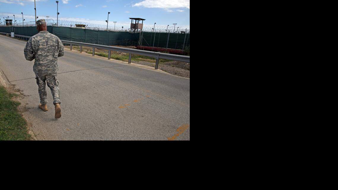 A soldier walks by Camp Delta (no longer holds detainees) at the U.S. Navy base at Guantanamo Bay, Cuba, on Tuesday, Nov. 4, 2014 in this photo approved for release by the U.S. military.