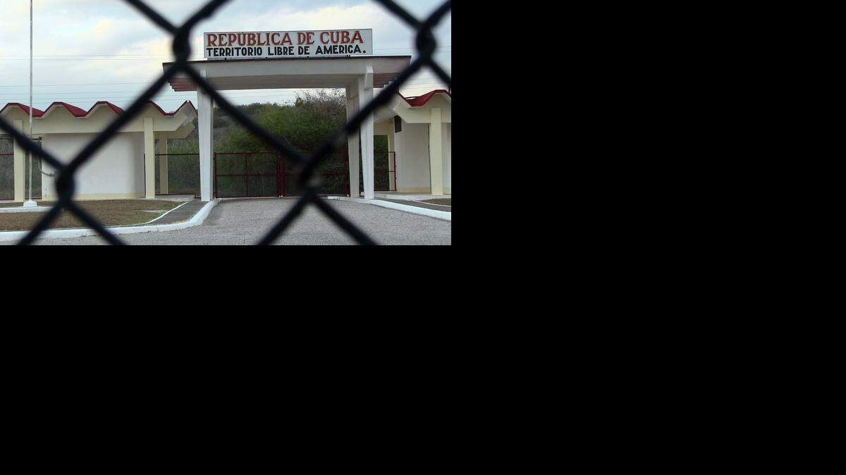 
Peering through the fence from the U.S.-controlled portion into the Cuban side of the Northeast Gate on March 20, 2014 at the U.S. Navy base at Guantánamo Bay, Cuba.
