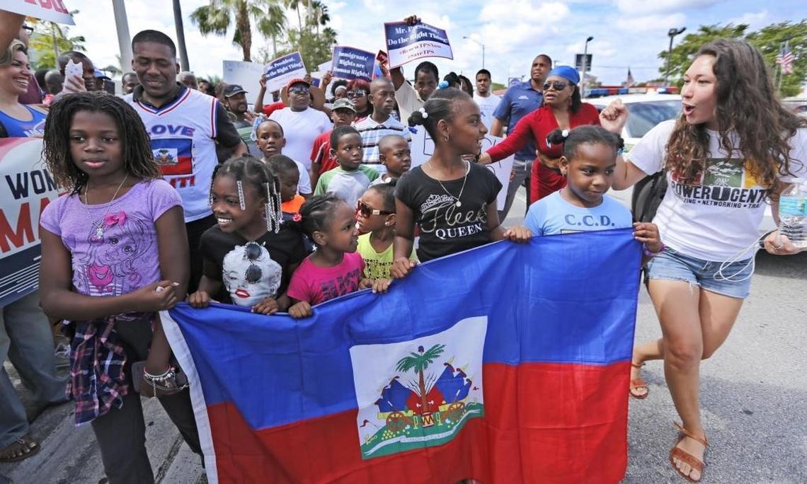 Haitian and immigration advocates hold a rally Saturday demanding the Trump administration extend Temporary Protected Status for Haitians as they march in front of U.S. Citizenship and Immigration Services office on Saturday, May 13, 2017.