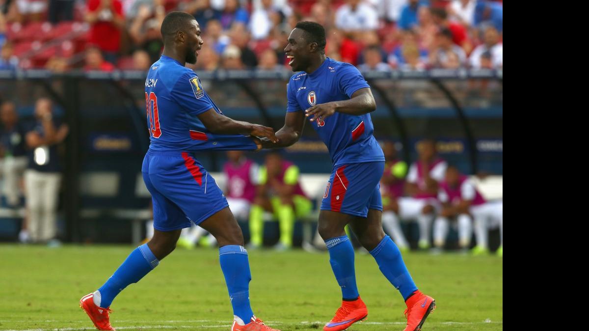 
Jeff Louis, right, shakes hands with a teammate after Haiti scored against Panama during the 2015 CONCACAF Gold Cup on July 7, 2015 in Frisco, Texas. Louis missed his flight from Boston to Kansas City and will not be on the field Monday in the 7 p.m. matchup between Haiti and Honduras.
