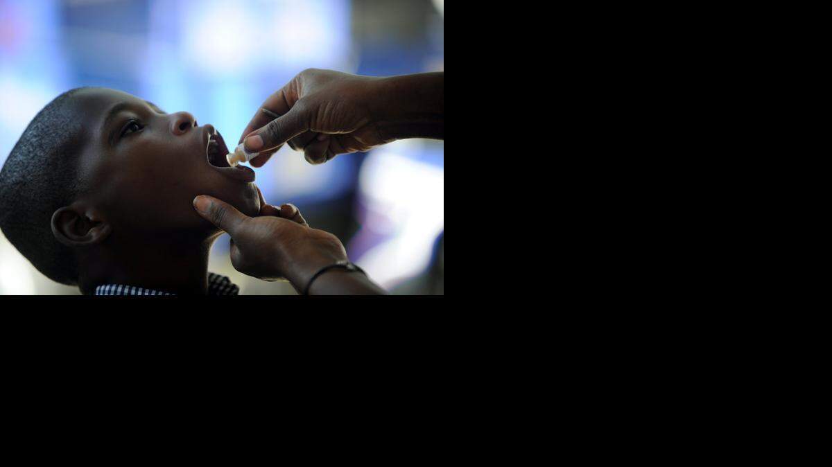 
A boy receives the second dose of the vaccine against cholera in Saut d'Eau, in the Central Plateau of Haiti, on Sept. 17, 2014.
