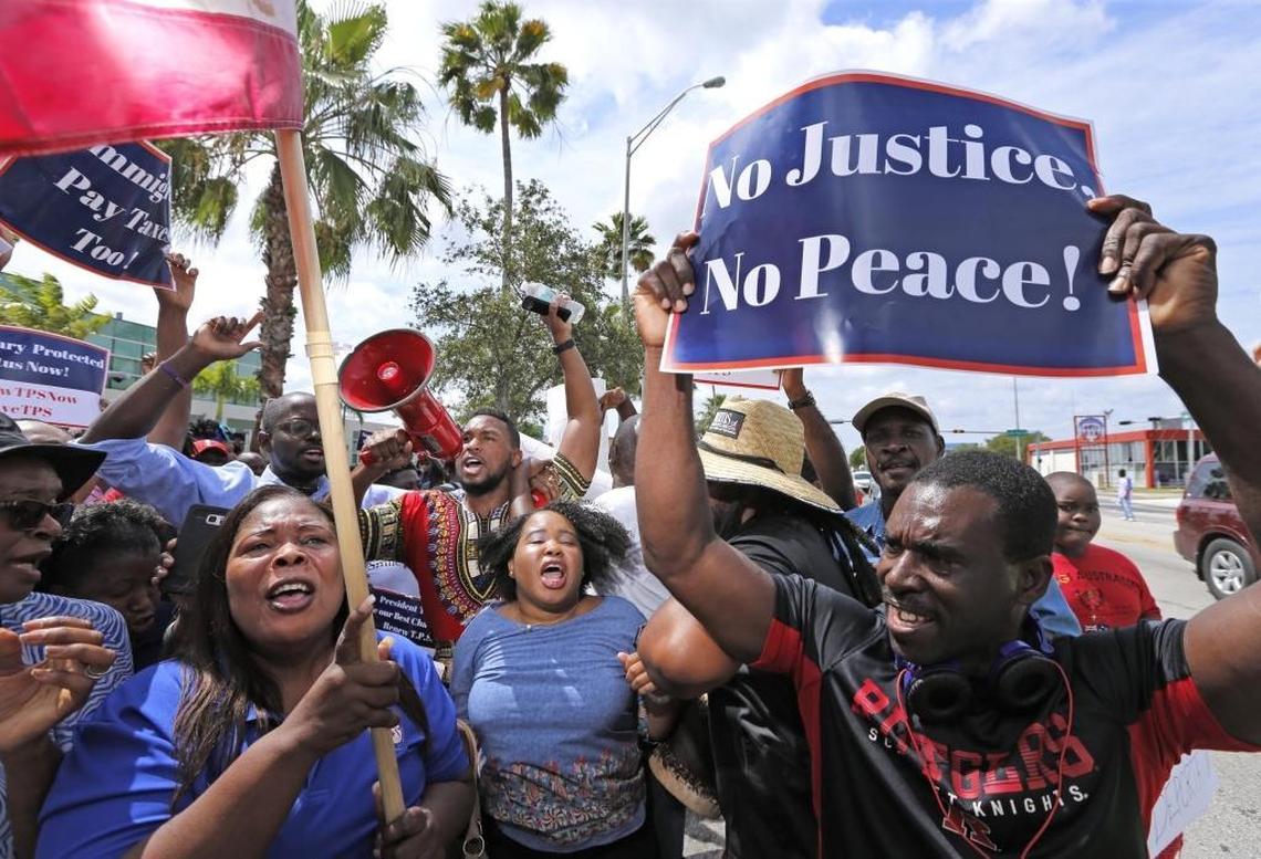 Haitian and immigration advocates hold a rally Saturday demanding the Trump administration extend Temporary Protected Status for Haitians as they march in front of U.S. Citizenship and Immigration Services office on Saturday, May 13, 2017.