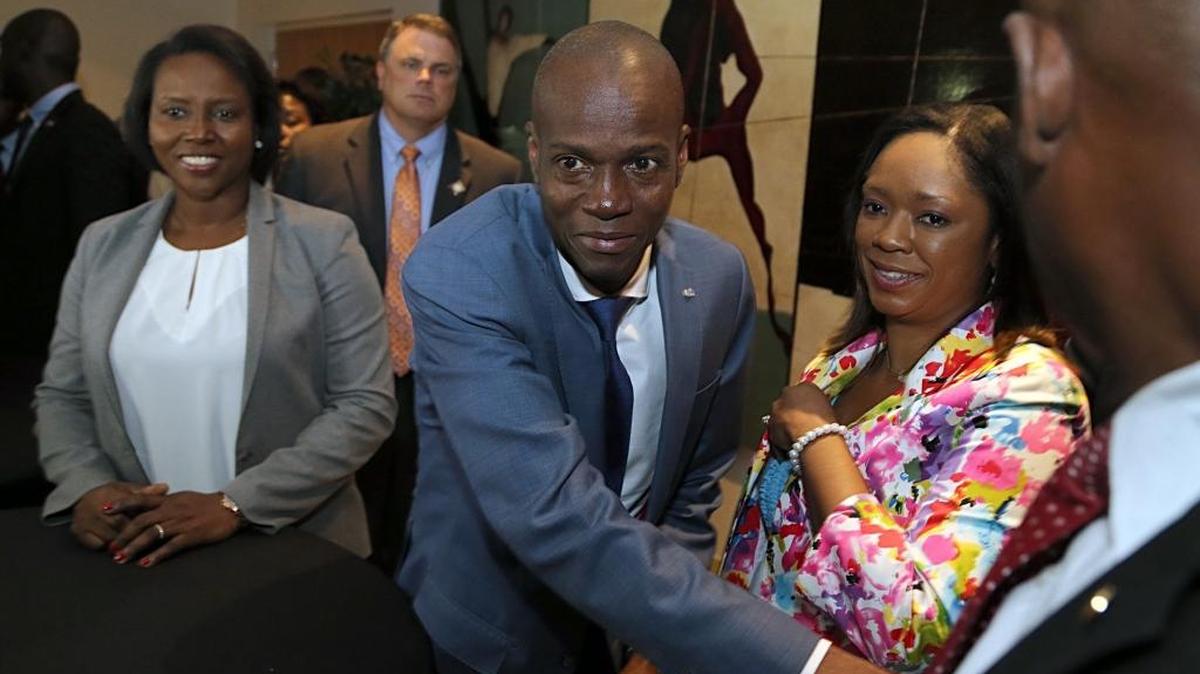 In this file photo, Haitian President Jovenel Moïse, greets a group of Haitians living in South Florida who welcomed him and his wife, Martine, as he made his first visit to Miami as president during a community meeting at the Little Haiti Cultural Center on Friday, June 16, 2017.