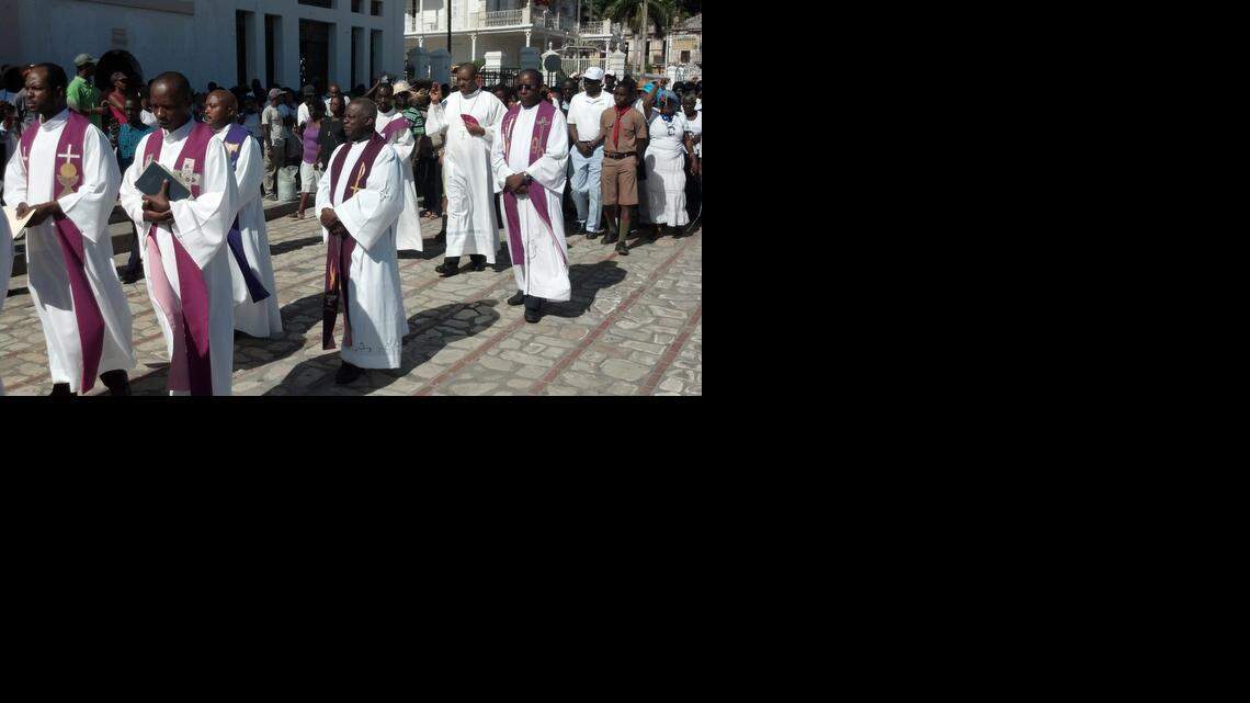 
The Archbishop of Cap-Haïtien, Bishop Max Leroy Mesidor, joins other priests, nuns and parishioners in a silent march last month in Haiti’s second-largest city to protest more than two dozen attacks against religious communities across the country. 
