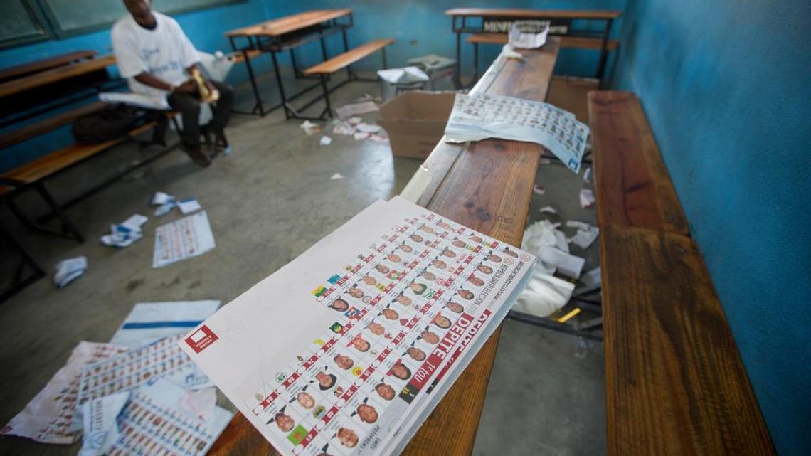 
A man sits inside a voting center after it was closed due to violence, during parliamentary elections in Port-au-Prince, Haiti, Sunday, August 9, 2015. Haitians are electing legislators to Parliament after a very long wait. It's been roughly eight months since the legislature was dissolved and nearly four years since the vote was supposed to be held.
