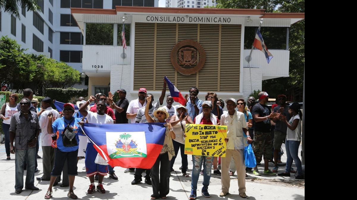 
Dozens of Haitians rally outside the Dominican Republic consulate on Brickell Avenue to protest the threatened mass deportation of Haitians from the Dominican Republic on Thursday, June 25, 2015. 
