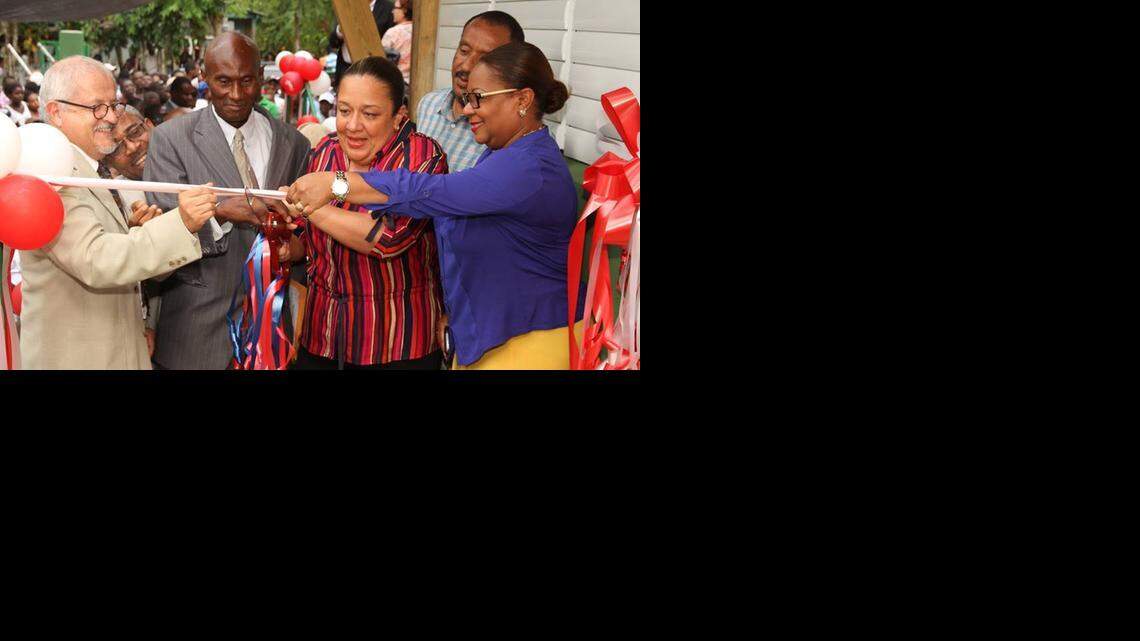 
Minister of Health Florence Duperval Guillaume, right, designated the interim prime minister of Haiti over the weekend, helps inaugurate a health center with firstr lady Sophia Martelly, center, in September.

