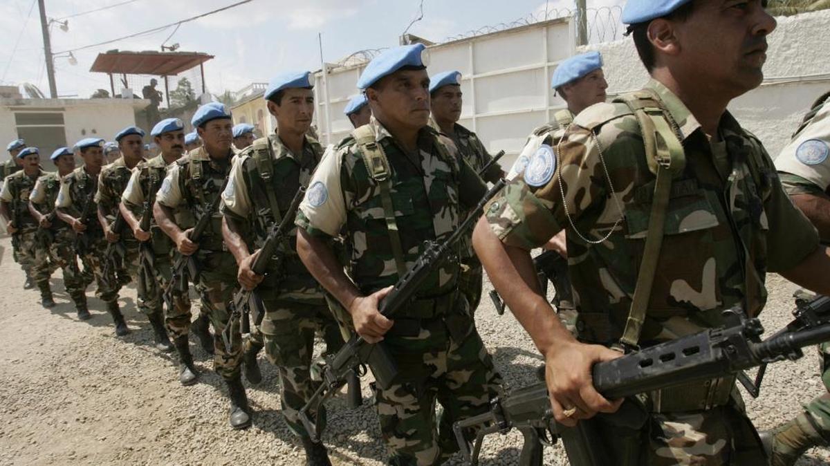 In this March 26, 2006, file photo, U.N. troops from Uruguay march during a transitional ceremony at the U.N. Spain base in Forte-Liberte, Haiti. Uruguay's president Tabare Vazquez said Monday, March 20, 2017, that his country is pulling its soldiers out of a United Nations peacekeeping mission in Haiti, where they have served since 2004.