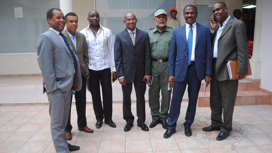 Seven opposition candidates in Haiti’s Oct. 25 presidential elections stand outside of the headquarters of the Provisional Electoral Council (CEP) in Petionville on Monday, Nov. 16. The group, which includes former Sen. Moise Jean-Charles (not shown), met with the CEP for two hours and 20 minutes to demand an independent commission to verify the vote count.