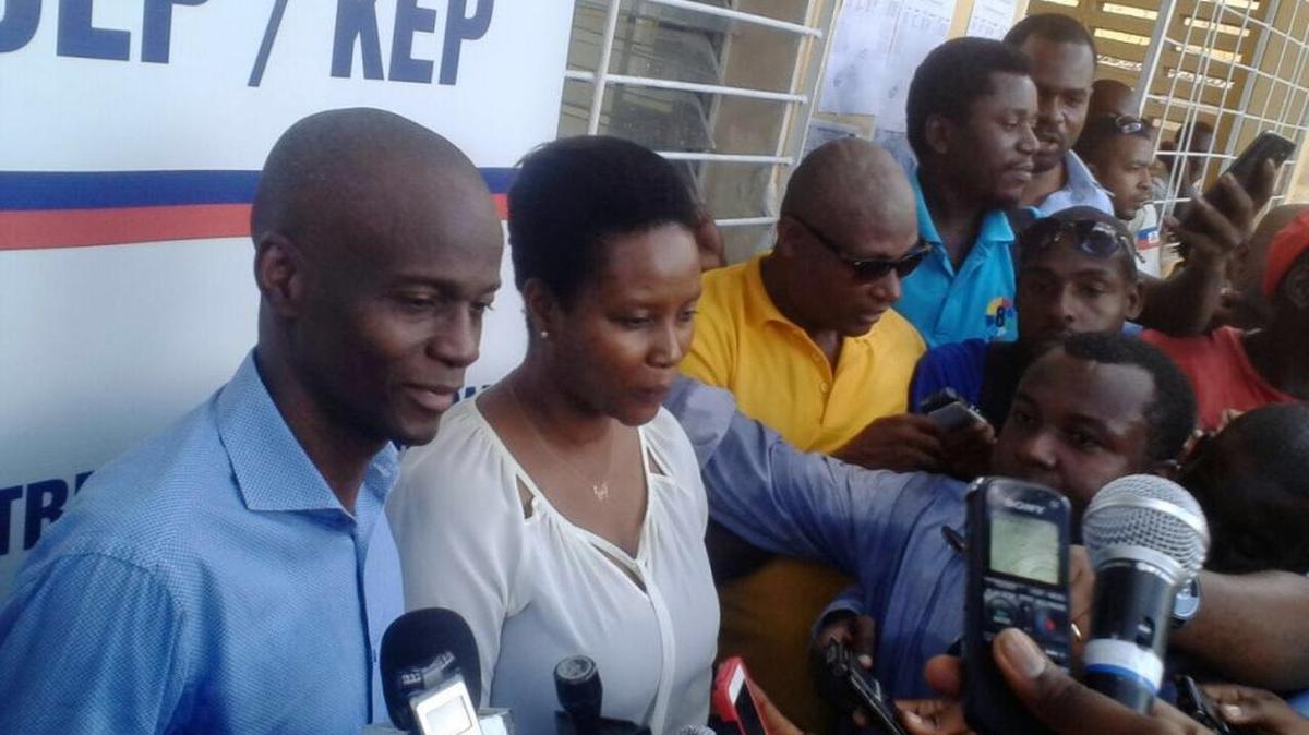 Jovenel Moise speaking to the press Wednesday in Port-au-Prince after confirming his participation in the Oct. 9 presidential rerun despite his camp threatening to boycott.