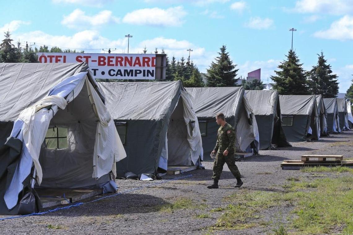 The migrant camp is expanded by the military located on the Canadian side of the U.S.-Canada border on Saturday, August 12, 2017. Thousands of people have crossed over into Canada from an irregular crossing near the Champlain - St. Bernard-de-Lacolle border in hopes of finding permanent residency. Among them are Haitians who were worried that their Temporary Protected Status in the U.S. could soon end under the Trump administration.