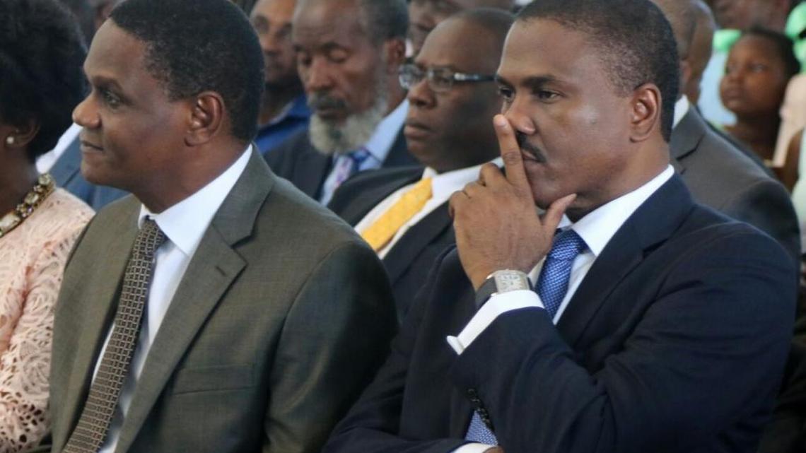 Haiti opposition presidential candidate Jude Celestin, left, next to his spokesman Gerald Germain at a church ceremony in Jacmel in May.
