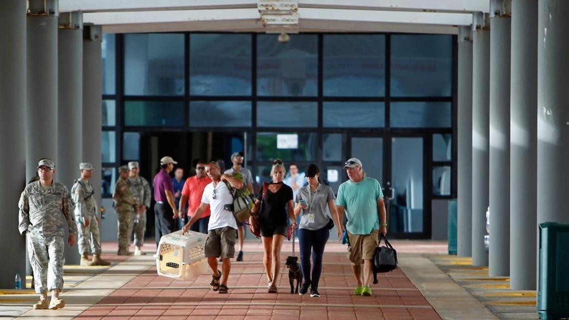 Evacuees disembark after arriving in San Juan, Puerto Rico, Thursday, Sept. 14, 2017, via a cruise ship packed with families evacuated from Caribbean islands devastated by Hurricane Irma. The U.S. territory of Puerto Rico has received nearly 2,000 U.S. citizens who were living or vacationing on in the U.S. and British Virgin Islands, including more than 500 who arrived via the cruise ship on Thursday, the first such arrival of its kind.