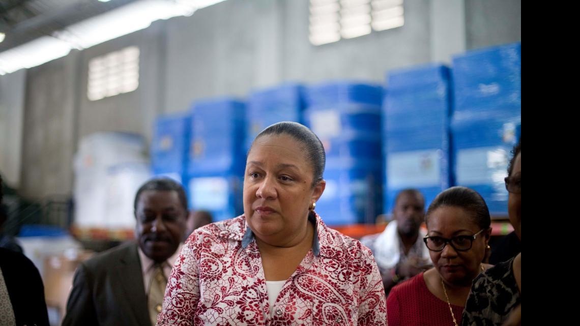 
In this Sept. 10, 2014, file photo, Haiti's first lady Sophia Martelly visits a warehouse housing a donation of kits to treat chikungunya in the Cite Soleil slum in Port-au-Prince, Haiti. An elections committee in Haiti has the rejected first lady's bid to run for Senate. 
