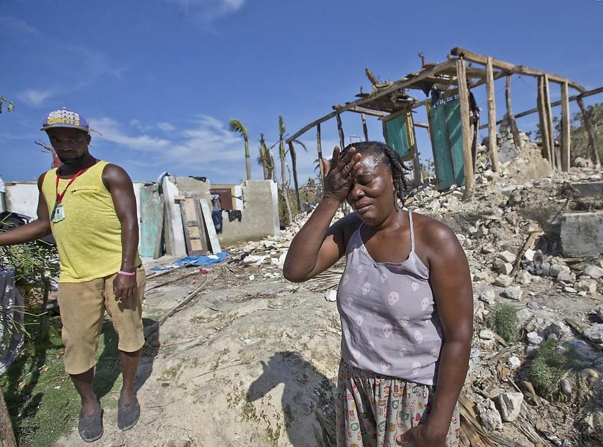 Marie Louse Valentin 54, weeps in front of her shattered home in Morne la Source, Haiti on Sunday, October 9, 2016 after Hurricane Matthew slammed the country’s southern peninsula.