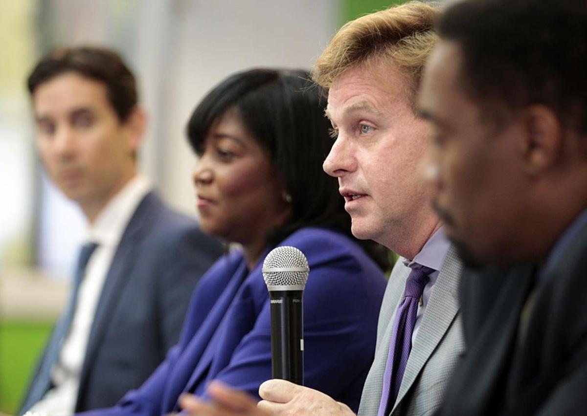 Randy McGrorty, second from right, CEO Catholic Legal Services, joined a group of immigration attorneys during a community meeting in Little Haiti Friday morning informing Haitians with TPS what their options are should the immigration relief not be renewed by the Trump administration.